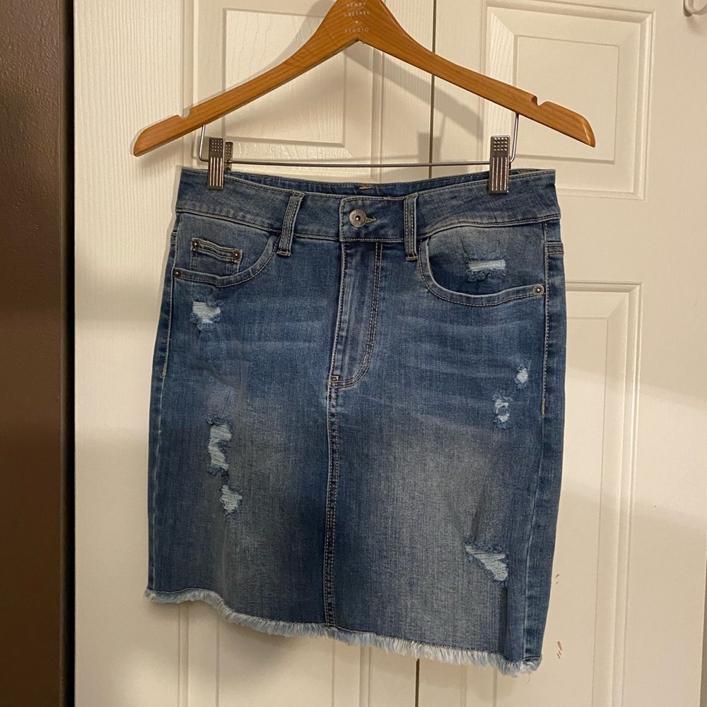 Light wash denim skirt with tear details